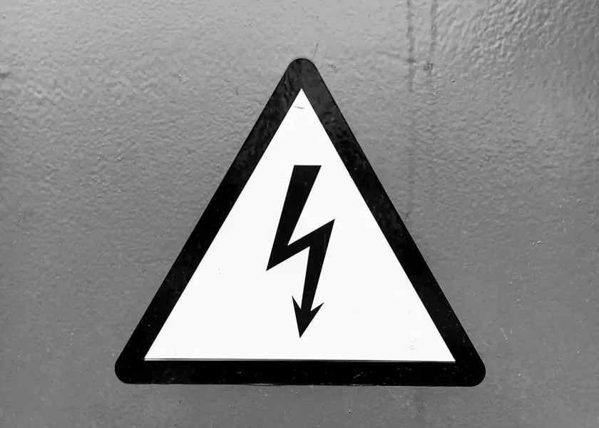 High-voltage warning sign on a wall