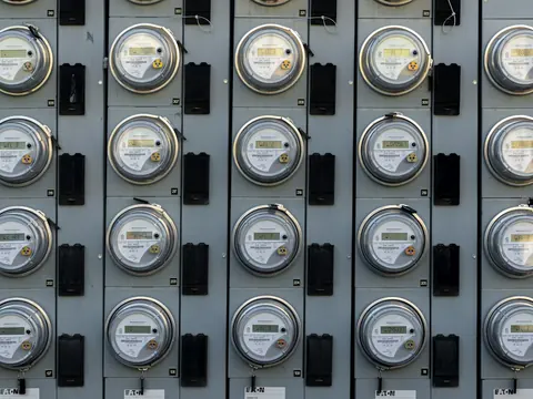 Bank of electricity meters on a distribution wall
