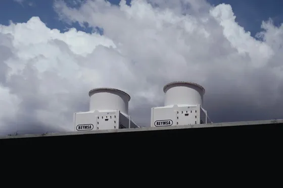 Rooftop cooling towers against the sky