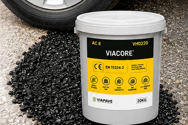 VIACORE 20 kg pail beside a bed of cold asphalt aggregate